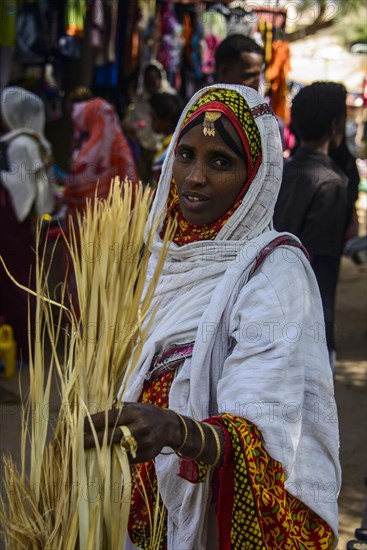 Woman shopping on the colourful Monday market of Keren