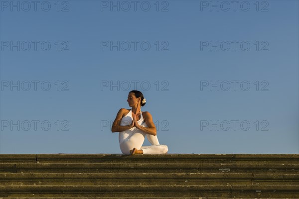 Young woman practising Hatha yoga
