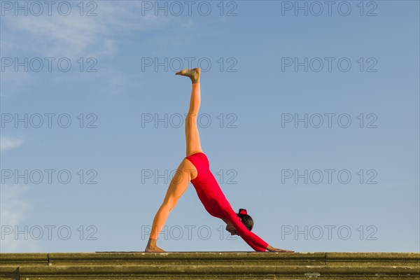 Young woman practising Hatha yoga