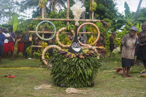 Traditional masked man at a Taboo death ceremony