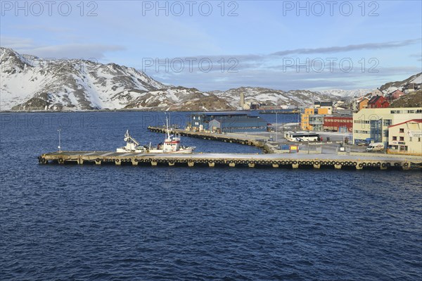 Pier with boat in bay