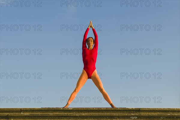 Young woman practising Hatha yoga