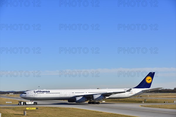 Lufthansa Airbus A340-600 with pushback truck