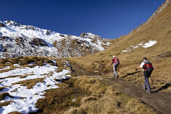 Mountain climbers ascending Wilde Kreuzspitze Mountain in the Pfunderer Mountains