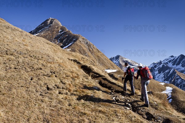 Mountaineers climbing Wilde Kreuzspitze Mountain in the Pfunderer Mountains