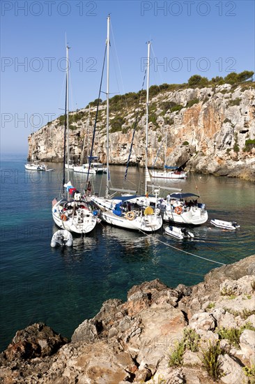 Yachts moored in the bay of Cales Coves
