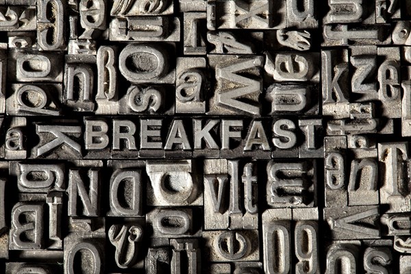 Old lead letters forming the word 'BREAKFAST'