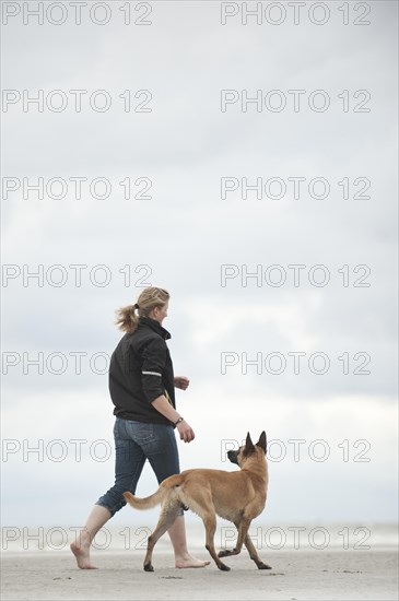 Woman with a Hollandse Herdershond