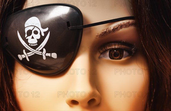 Shop-window mannequin wearing an eye patch