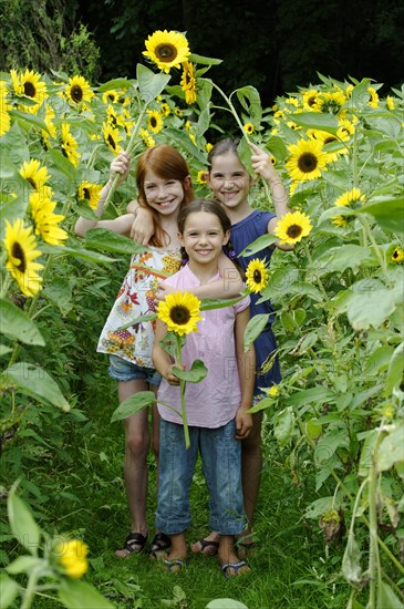 Girls in a sunflower field