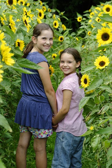 Girls in a sunflower field