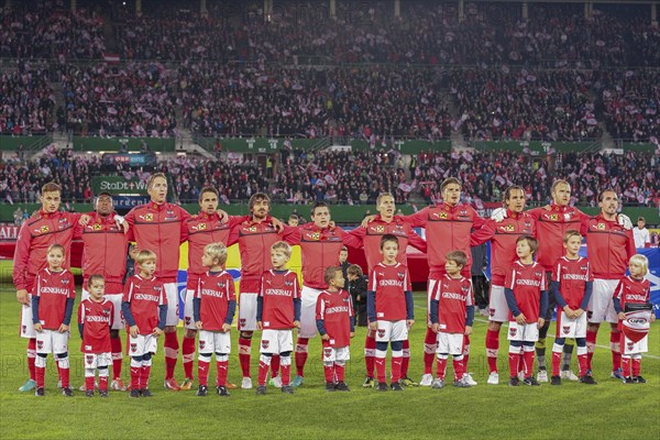 The Austrian team poses before the WC qualifier soccer game on October 16