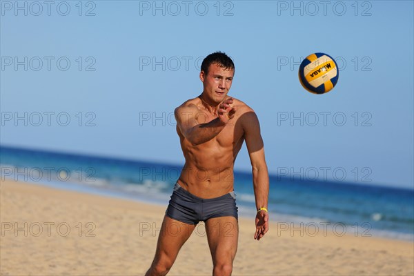 Man playing beach volleyball