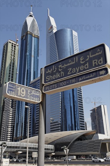 Street sign for Sheikh Zayed Road in front of skyscrapers