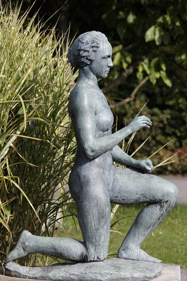 Kneeling woman