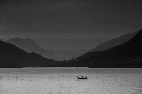 View over Weissensee lake towards Techendorf in the evening light