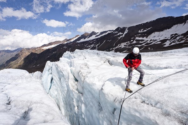 Alpinist at a crevasse rescue on Zufallferner glacier in the Martelltal valley