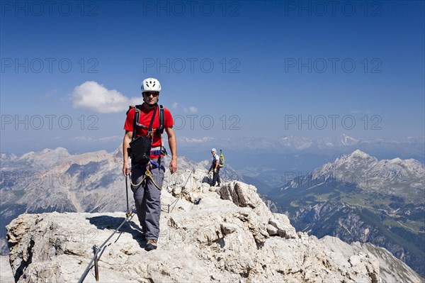 Climber on the way down from the summit of Cristallo di Mezzo mountain