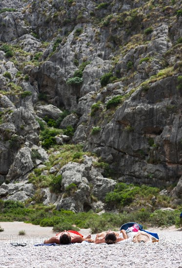 Tourists sunbathing in Torrent de Pareis Gorge