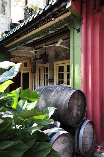 Wooden wine barrels in front of the Que Pasa bar