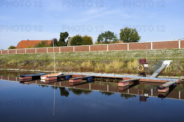Marina with a flood protection wall in Stiepelse