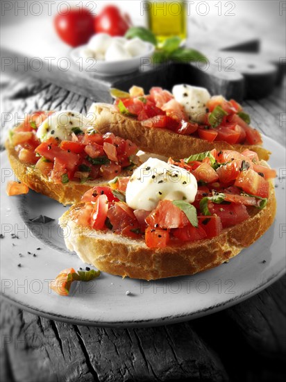 Fresh chopped beefsteak tomato with mini mozerellas bruschettas