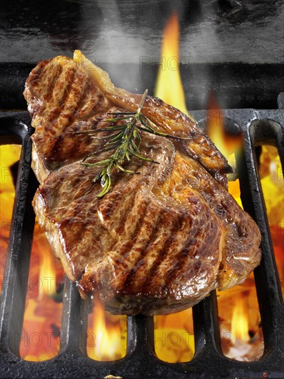 Sirloin beef steaks being cooked on a BBQ