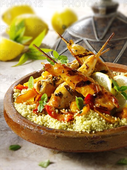 Couscous with Mediterranean roast vegetables and chicken kebabs