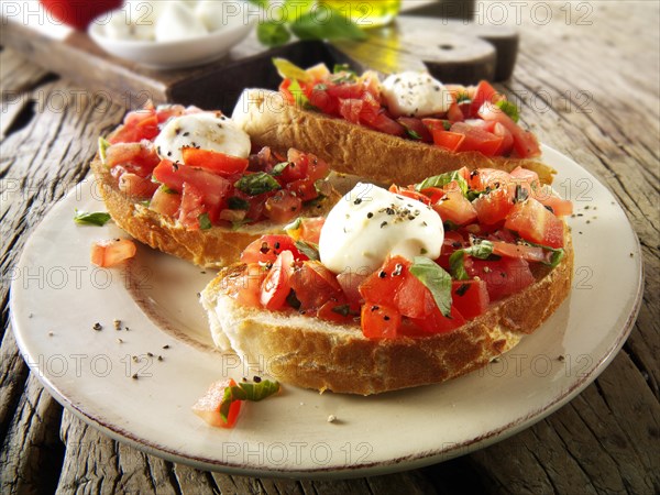 Fresh chopped beefsteak tomato with mini mozzarellas bruschettas