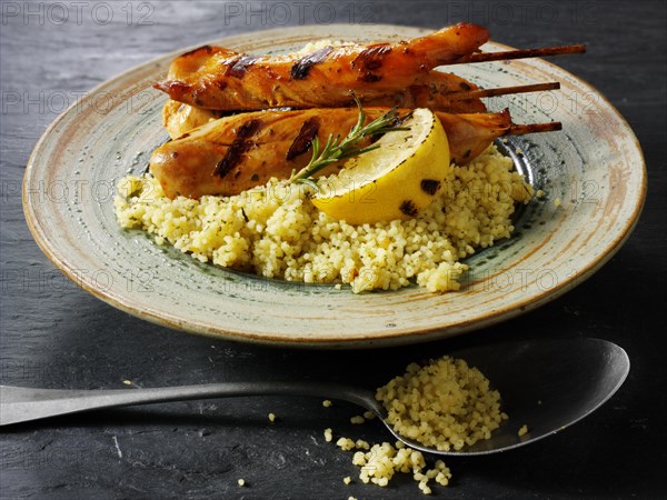 Couscous with Mediterranean roast vegetables and chicken kebabs