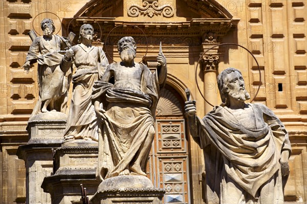 Sculptures in front of baroque Cathedral of Modica