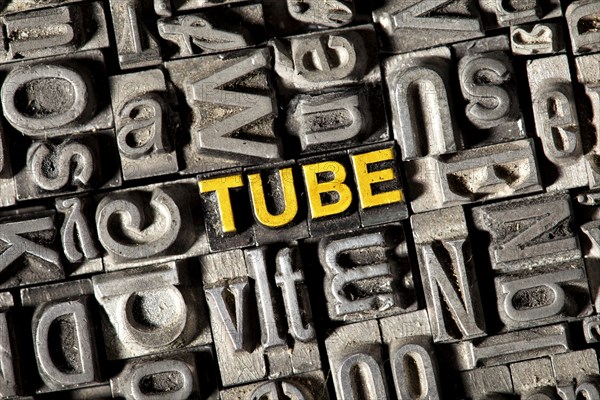 Old lead letters forming the word Tube