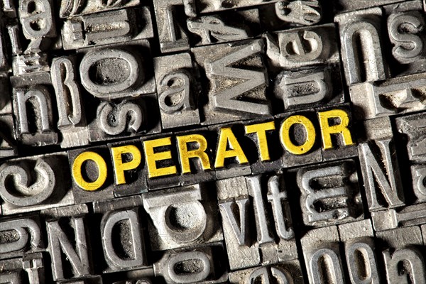 Old lead letters forming the word "OPERATOR"