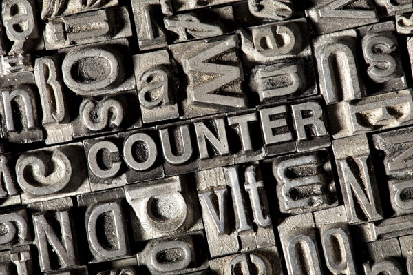 Old lead letters forming the word COUNTER