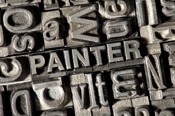 Old lead letters forming the word PAINTER