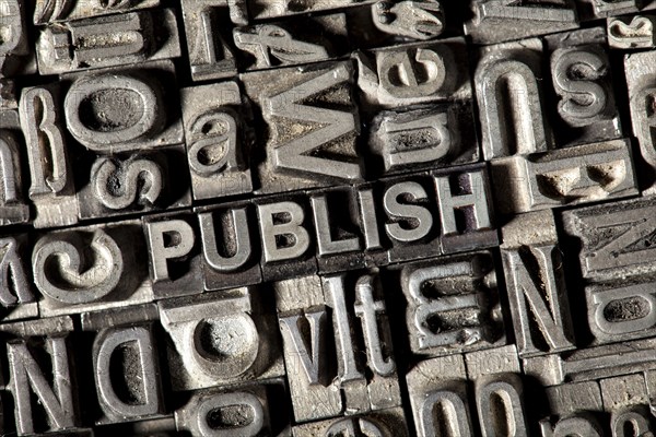 Old lead letters forming the word 'PUBLISH'