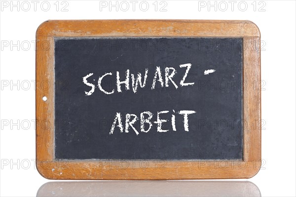 Old school blackboard with the term SCHWARZARBEIT
