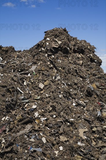 Pile of discarded automotive debris at a waste management site