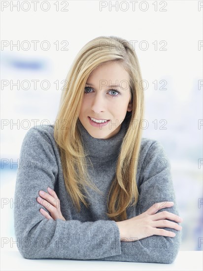 Young woman wearing a gray sweater