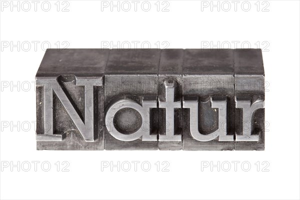Old lead letters forming the word 'Natur'