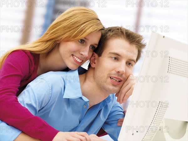 Young couple using a computer