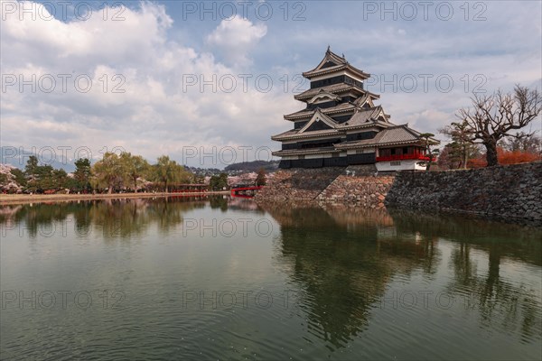 Old Japanese castle reflected in the moat