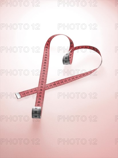 Pink tape measure shaped as a heart