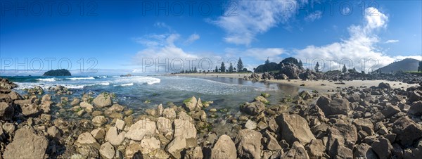 Sandy beach beach of Mount Manganui with island Motiti Island
