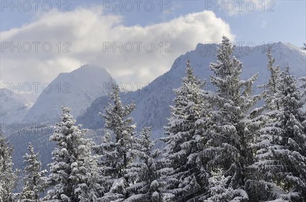 Snow clouds over winter mountain landscape