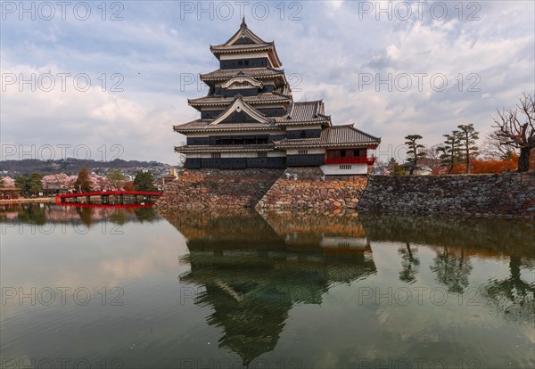 Old Japanese castle reflected in the moat