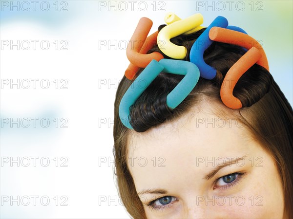 Young girl with soft-curl papillotes in her hair