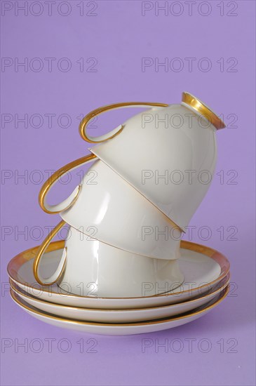 Antique coffee cups with a gold rim