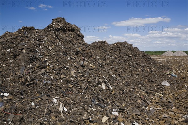 Pile of discarded automotive debris at a waste management site