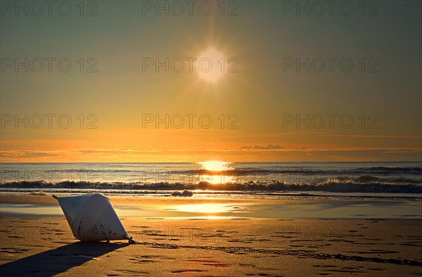 Buoy lying on the beach
